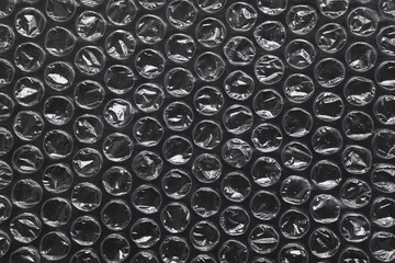 Bubble wrap texture. The film protects the surface from impact. Polyethylene.