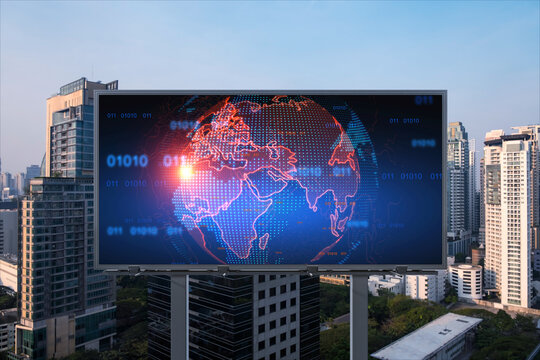 Glowing hologram of Earth planet map on billboard over aerial panoramic cityscape of Bangkok at sunset. The concept of international business in Southeast Asia.
