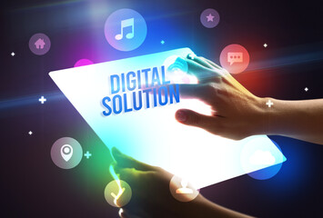 Holding futuristic tablet with DIGITAL SOLUTION inscription, new technology concept