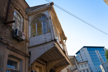 Fototapeta na wymiar Wooden patterned balcony view from the street