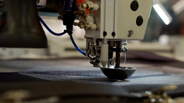The work of the sewing machine close-up.