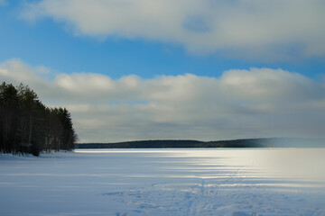 Blue sky over a snow-covered lake.