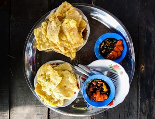 fry mendoan and chili sauce ont brown background