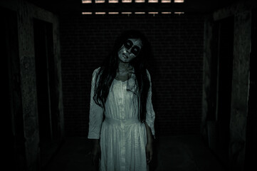 Portrait of asian woman make up ghost face,Horror scene,Scary background,Halloween poster