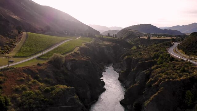 Birds eye view above canyon showing vineyard, scenic rural area of New Zealand