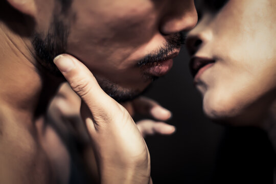 Beard guy kissing his girlfriend with passion of love Young Couple kiss each other tenderness Close up mouth to mouth selective focus Handsome boyfriend love his girlfriend so much and giving kiss