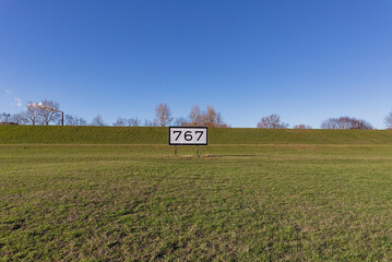 Krefeld - View to River Rhine Dike nearby Saint Matthias, where the naval sign indicats the 767 kilometer from Konstanz and ends at 1032 Hoek van Holland