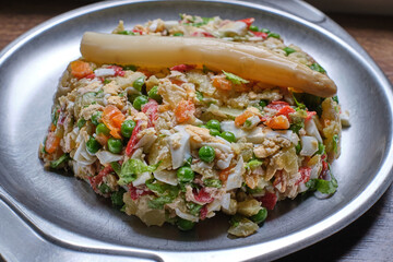Russian salad with peas, carrots, potatoes and asparagus