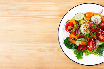 Fresh vegetable salad, on a wooden table, top view, horizontal, no people,