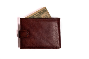 Brown male closed wallet with money on a white background.