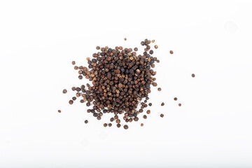 Pile of Black peppercorns (Black pepper) seeds isolated on white background.