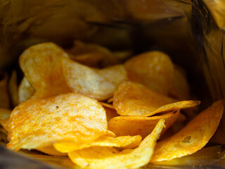 beautiful chips inside the bag. delicious slices of potatoes fried in butter. junk food.