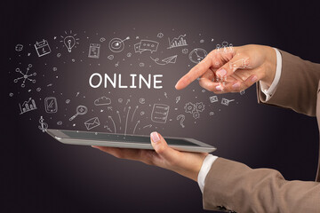Close-up of a touchscreen with ONLINE inscription, social media concept