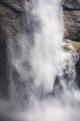 Fototapeta na wymiar Close up of water flowing from Upper Yosemite Falls smashing on the rock walls, Yosemite National Park, California