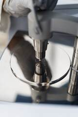 Hands handing laboratory equipment