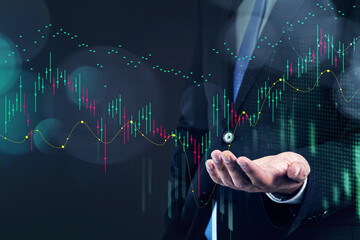 Businessman, trader holding a hand to make a prediction about stock market behavior, forecast and...