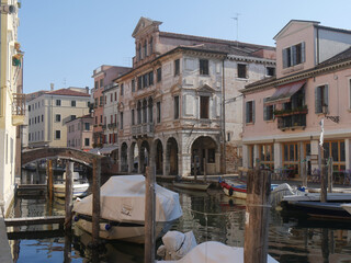 Naklejka premium Chioggia, Vena Canal with colorful ancient buildings on both sides and Grassi Palace