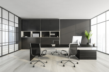 Black and white consulting room with furniture and windows