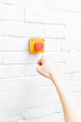 Press the emergency switch on the wall