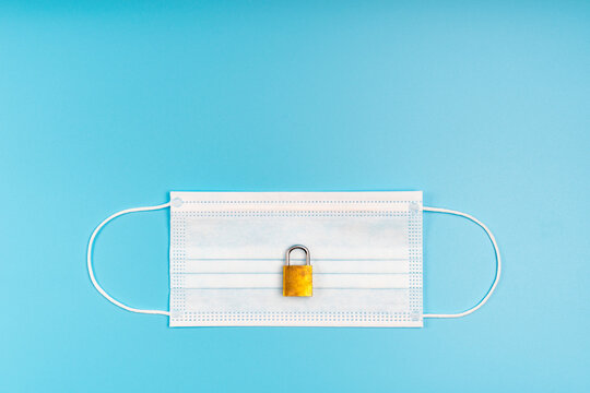 Medical Mask And Padlock Concept Of Quarantine Protection From Viruses