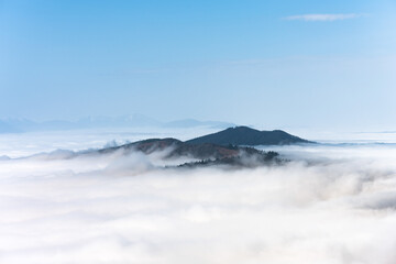 Mountain Range Emerging From The Clouds