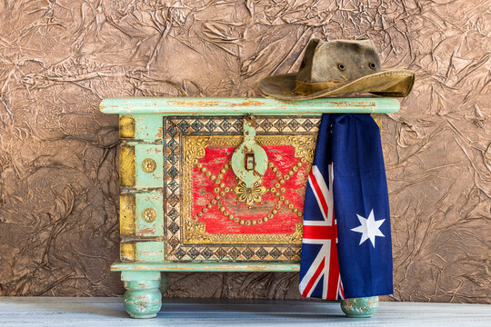 stylish pirate treasure chest with travel hat and australian flag, adventure and travel concept
