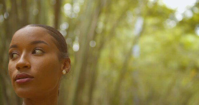 Amazing close up of a pretty face model in a bamboo cathedral