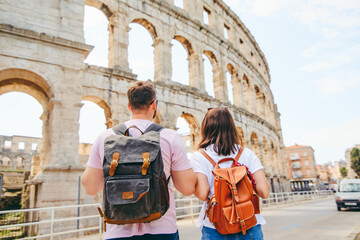 happy beautiful couple in front of coliseum in Pula Croatia