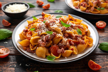 Conchiglie alla Amatriciana pasta with pancetta bacon, tomatoes and pecorino cheese. Healthy Italian food
