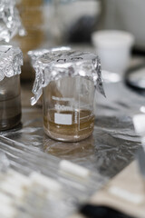 hand handing laboratory equipment and preparing samples