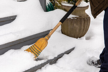 For Winter safety at home - clearing snow from steps and stairs after a snow storm