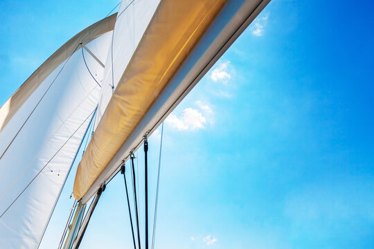 White sails against clear blue sky