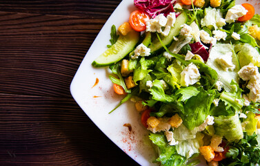 vitamin salad of fresh vegetables on a white plate close-up