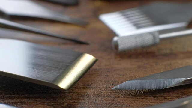 Macro footage.Other Tanner tools. A leather craftsman makes leather wallets. Men's wallets and tools. Tanner business. Close up. 