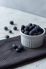 Blueberries in the bowl on the towel