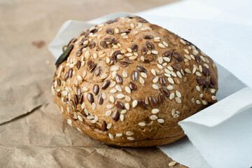 bun with cereals in paper bag when selling packaging
