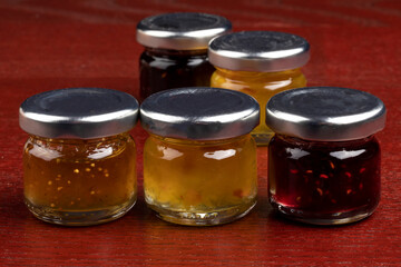 A variety of closed personal Jars of marmalade, jelly and jam