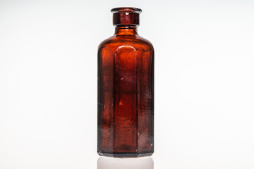 Antique poison medicine bottles on white background