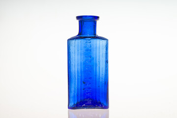 Antique poison medicine bottles on white background