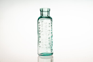 Antique poison medicine bottles on white background