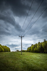 overhead electric cables on wooden poles