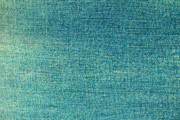 Texture closeup of worn denim fabric