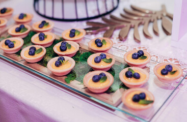 small cakes with blueberries on the table