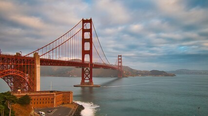 Beautiful view of famous Golden Gate Bridge in San Francisco in the rays of the setting sun