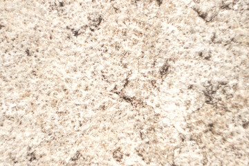 Texture of non-uniform surface with white and dark spots