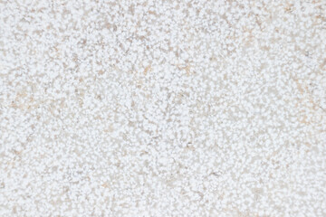 texture of light-colored tiles with small white spots