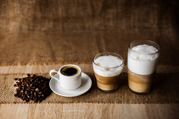 Coffee beans and a white cup, espresso. Space for text