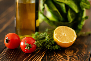 fresh herbs and vegetables on the wooden background