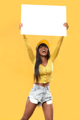 Positive girl holding a banner in her hands.