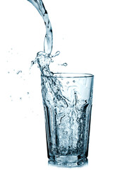 Water pouring in a glass, close up